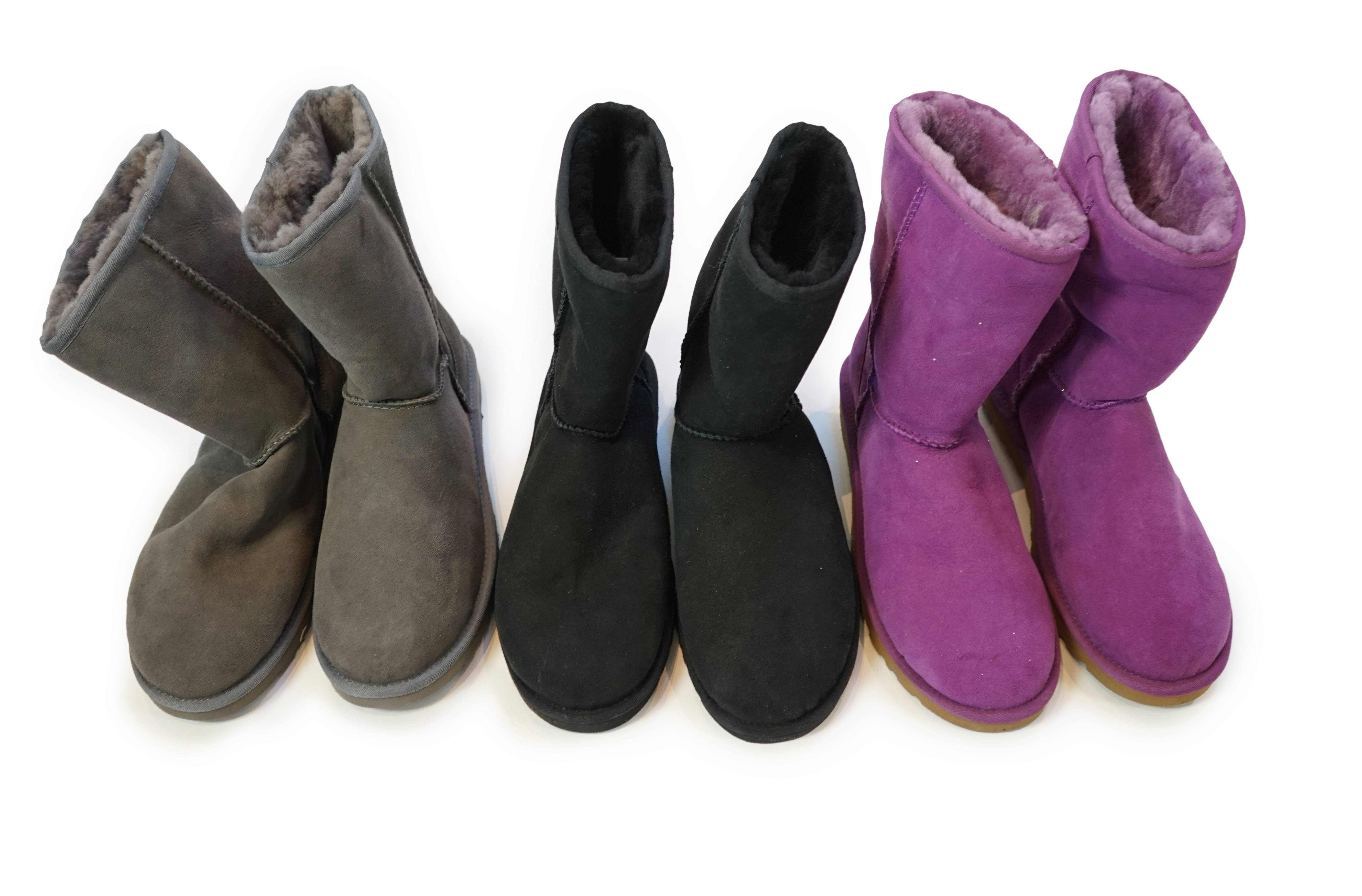 Three pairs of lady's sheepskin UGG boots, size UK 7.5